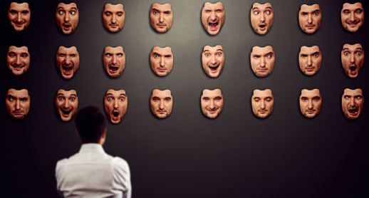 businessman looking at mask and selecting his mood